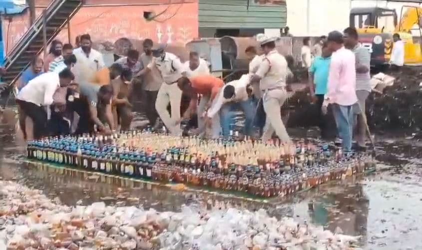 Video: Cops Try To Destroy Liquor Bottles With Bulldozer, Locals Steal Them