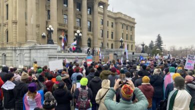 Protester Rally At Alberta Legislature To Oppose Bills Affecting Trans Rights
