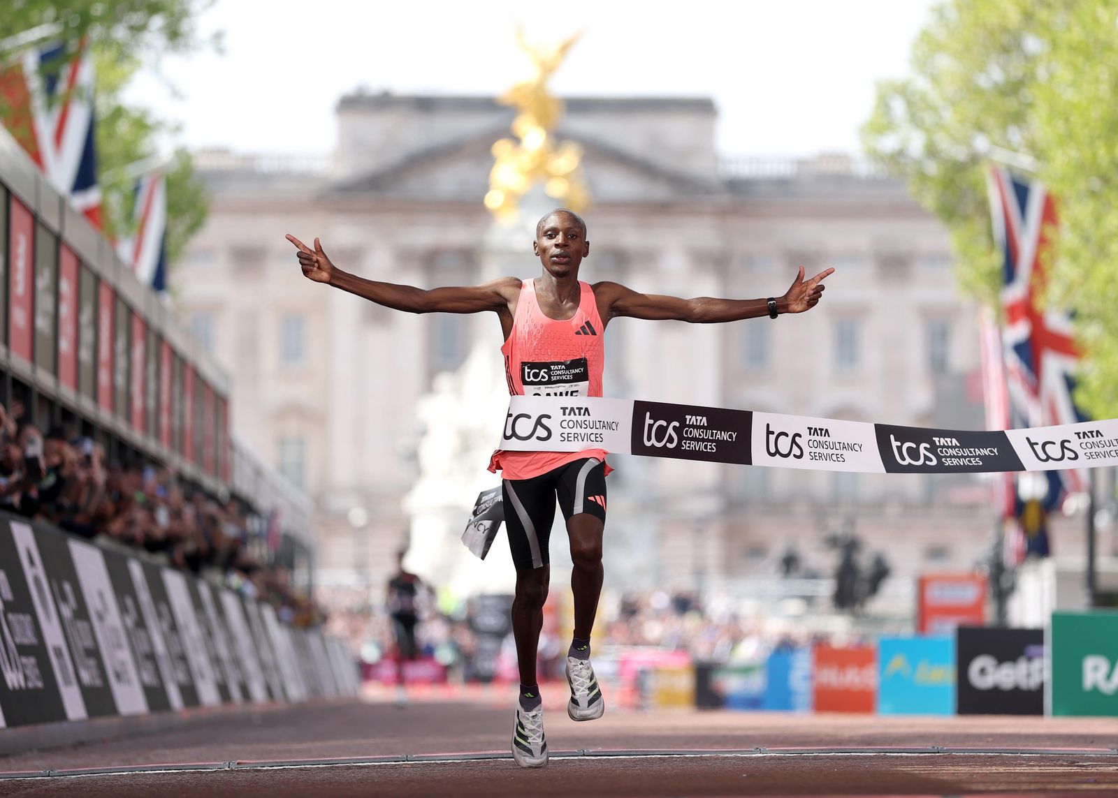 Image may contain Head Person Face Athlete Sport Happy Triumphant Clothing Footwear and Shoe