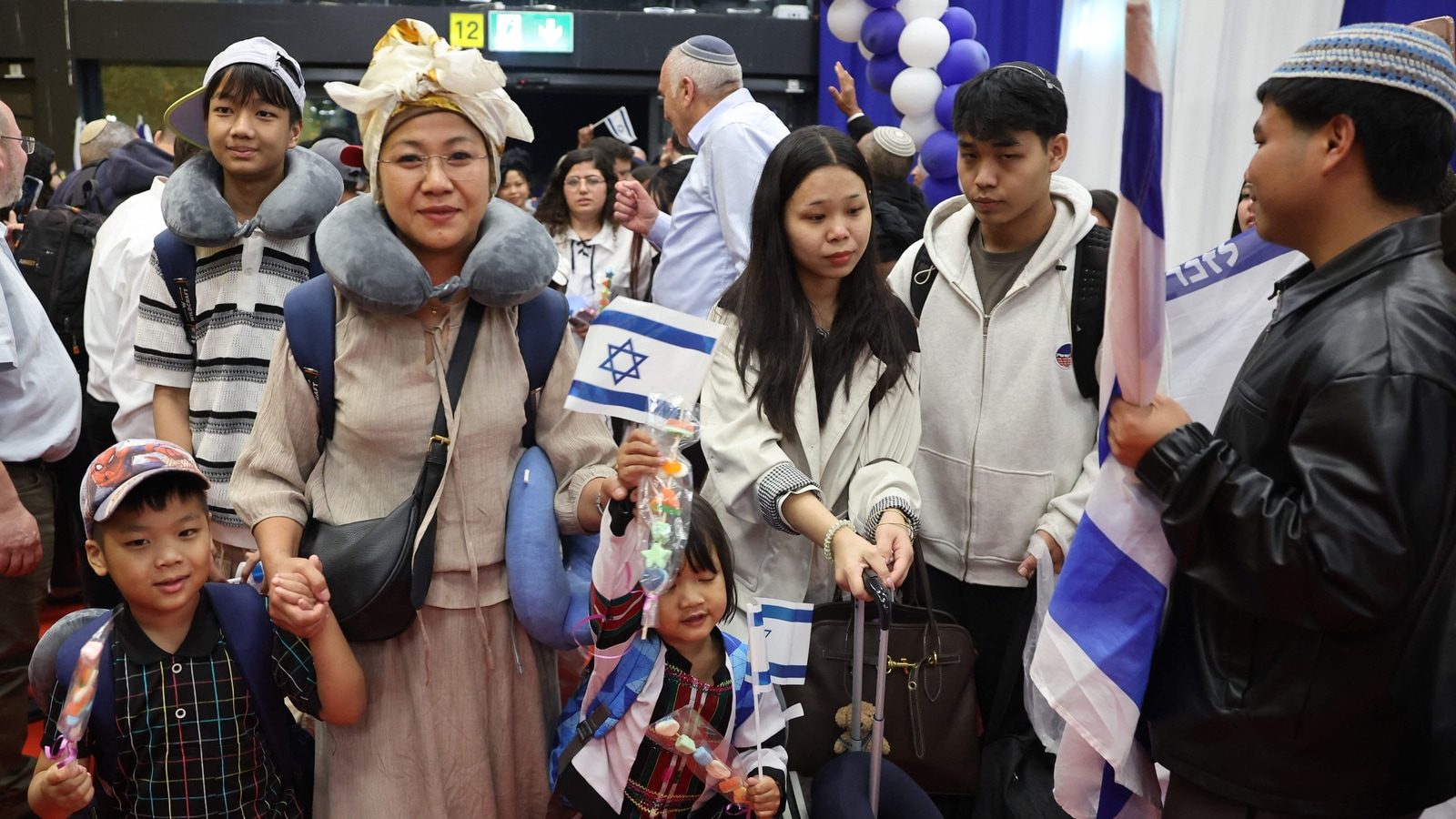 Members of the Bnei Menashe (Sons of Manasseh) community in India arrive at Ben Gurion Airport in Lod, near Tel Aviv, on April 23, 2026. (AFP)