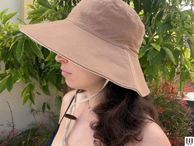 Image may contain: Clothing, Hat, Sun Hat, Adult, and Person
