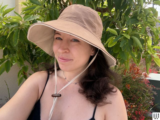 Image may contain: Clothing, Hat, Sun Hat, Adult, and Person