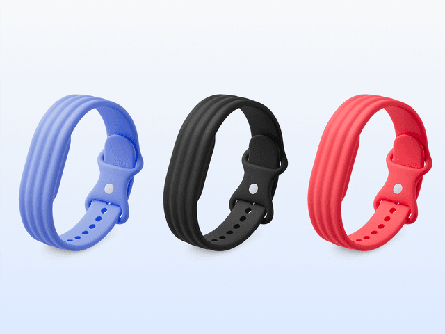 Four wristbands for smartwatch, side by side, in purple, black, pink, and white