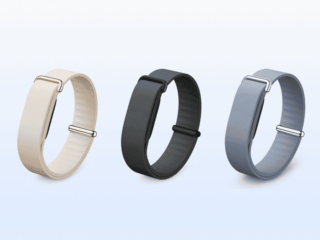 Three wristbands for smartwatch, side by side, in beige, black, and grey