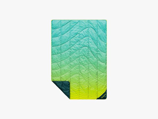 Rumpl Backcountry Puffy Blanket with a teal to lime green gradient design and the bottom left corner turned upwards