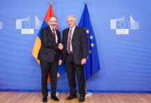 Armenian Prime Minister Nikol Pashinyan with European Union flags at the European Commission