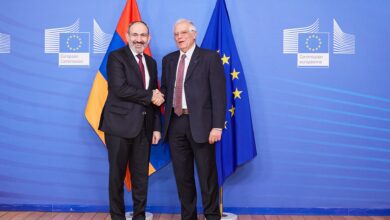Armenian Prime Minister Nikol Pashinyan with European Union flags at the European Commission