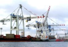 Container cranes and cargo ships at the Port of Hamburg in Germany
