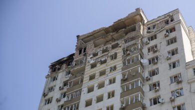 A damaged high rise apartment building in Kyiv after a Russian drone attack
