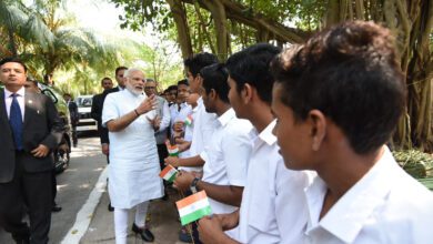 Prime Minister Narendra Modi speaking with a group of students