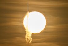 Actual August 30, 2026 launch photograph of the Falcon Heavy carrying Roman silhouetted against the Sun