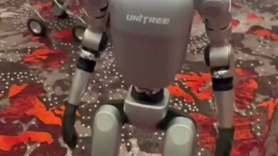 A Unitree G1 humanoid robot standing at a technology exhibition