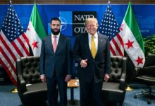 US President Donald Trump standing with Syrian President Ahmed al-Sharaa