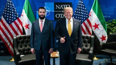 US President Donald Trump standing with Syrian President Ahmed al-Sharaa