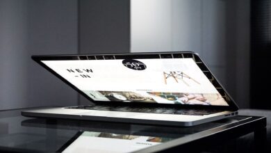 Person using a card to shop online on a computer