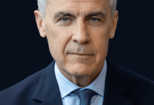 Portrait of Canadian Prime Minister Mark Carney against a blue background.