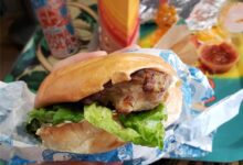 Illustrative chicken burger photograph; not the recalled Compliments package
