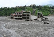 Flood-damaged buildings surrounded by debris after the 2026 Rasuwa disaster in Nepal