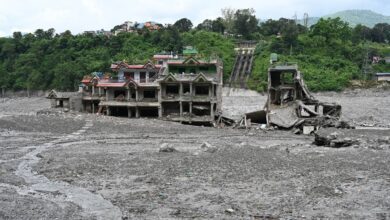 Flood-damaged buildings surrounded by debris after the 2026 Rasuwa disaster in Nepal