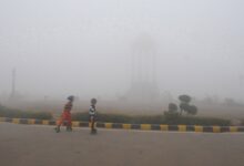 India Gate partly obscured by low visibility in New Delhi