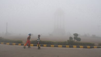 India Gate partly obscured by low visibility in New Delhi