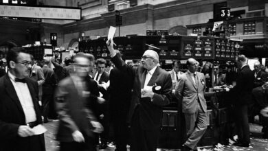 Archive photograph of brokers working on the New York Stock Exchange floor