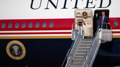 President Donald Trump disembarks Air Force One at Ellington Field in Houston, Texas.